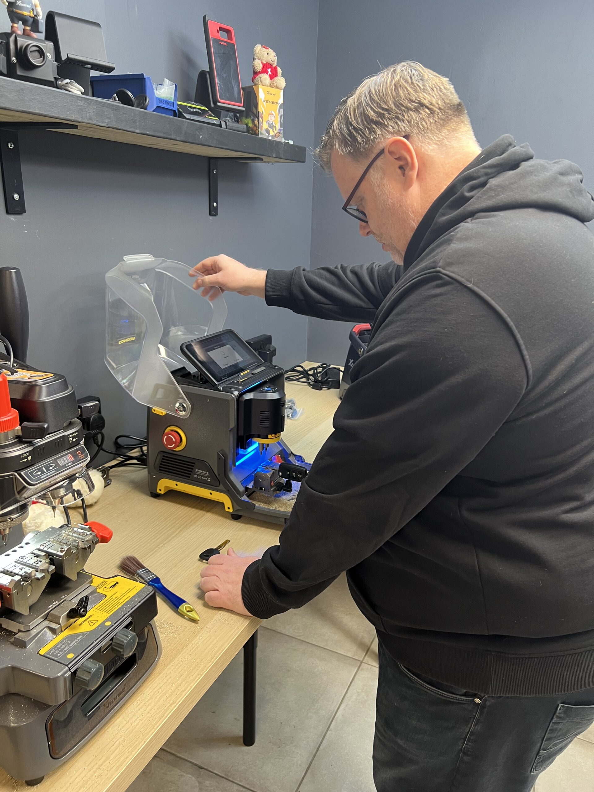 Electronic key cutting machine in operation