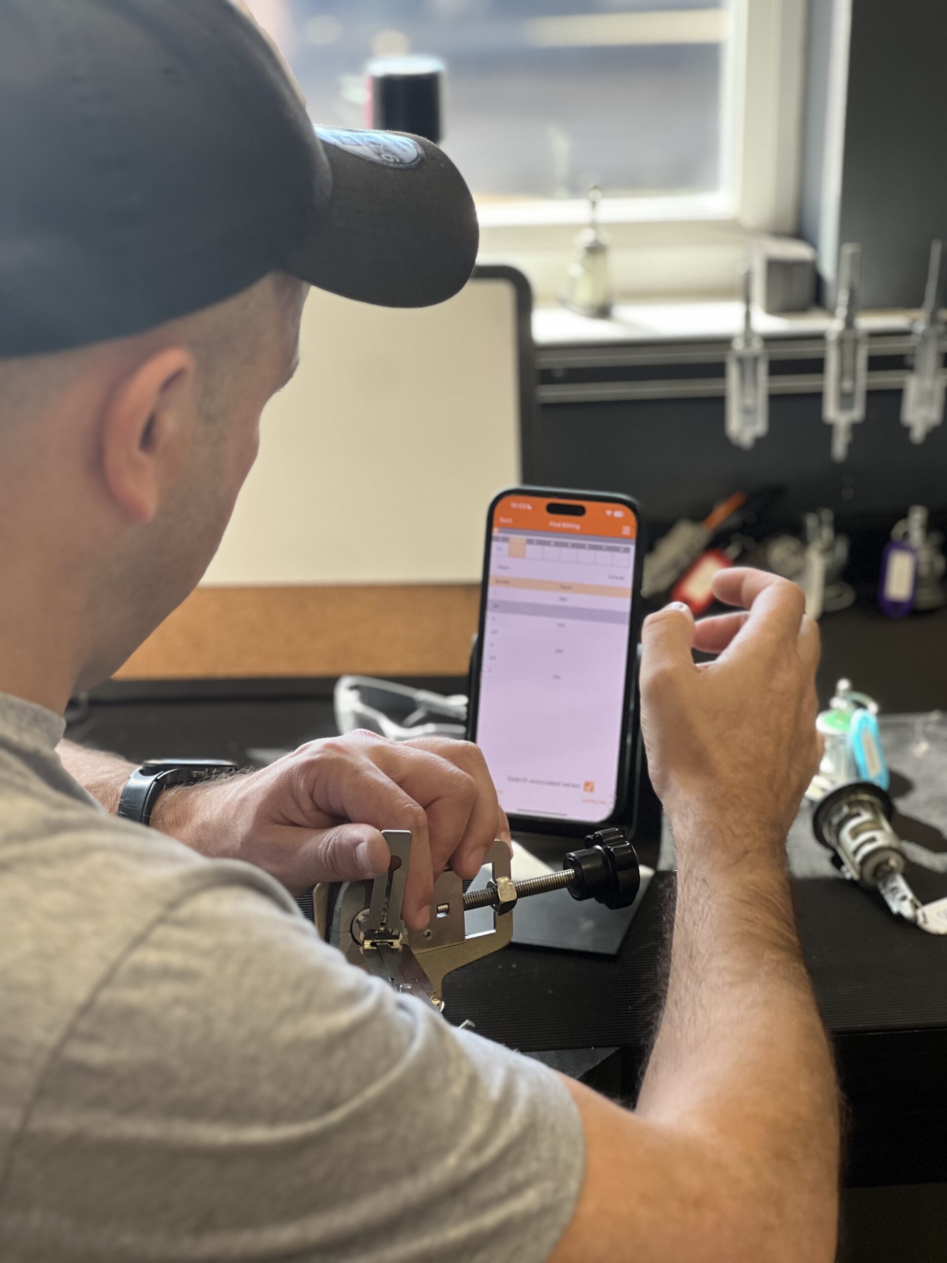 Student using a manual key duplicator