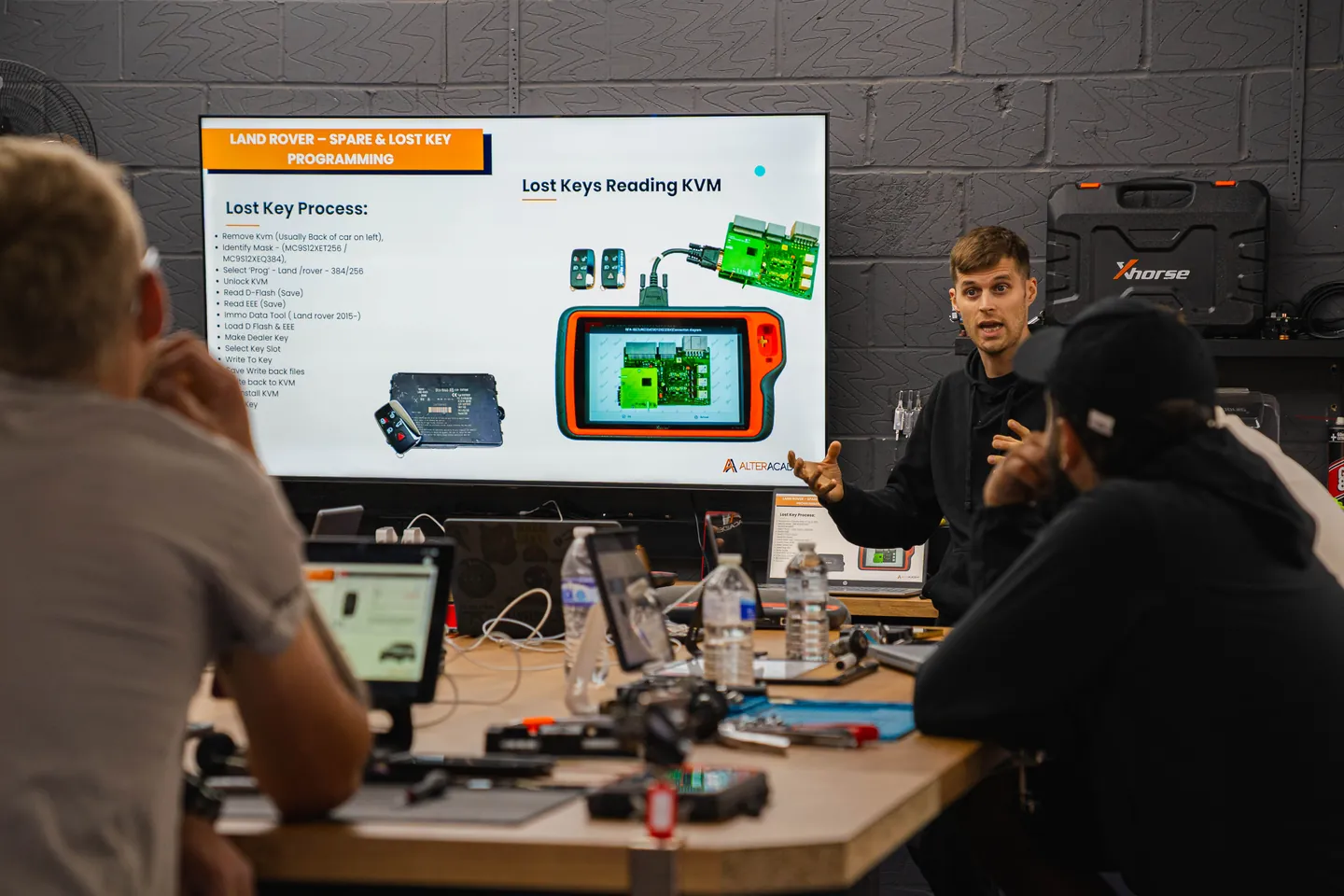 Tyler takes the class through Land Rover key programming on the big screen