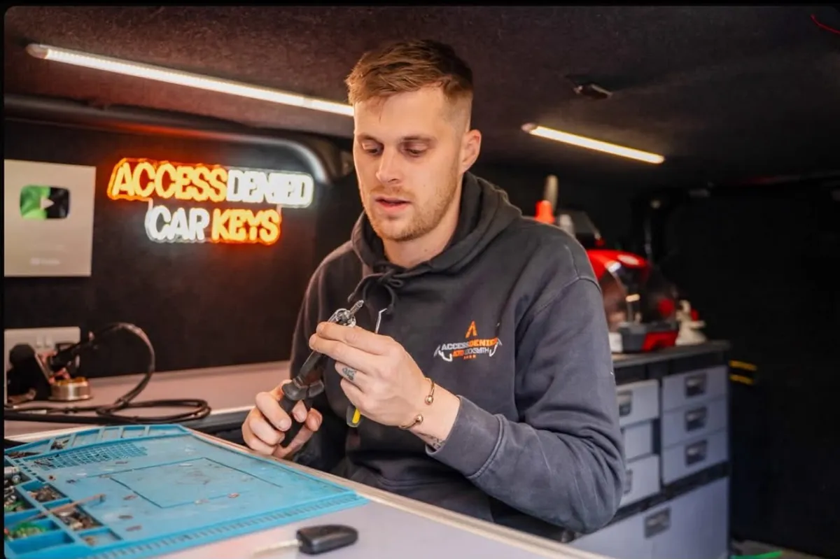 Tyler Steadman at the key programming bench in his van